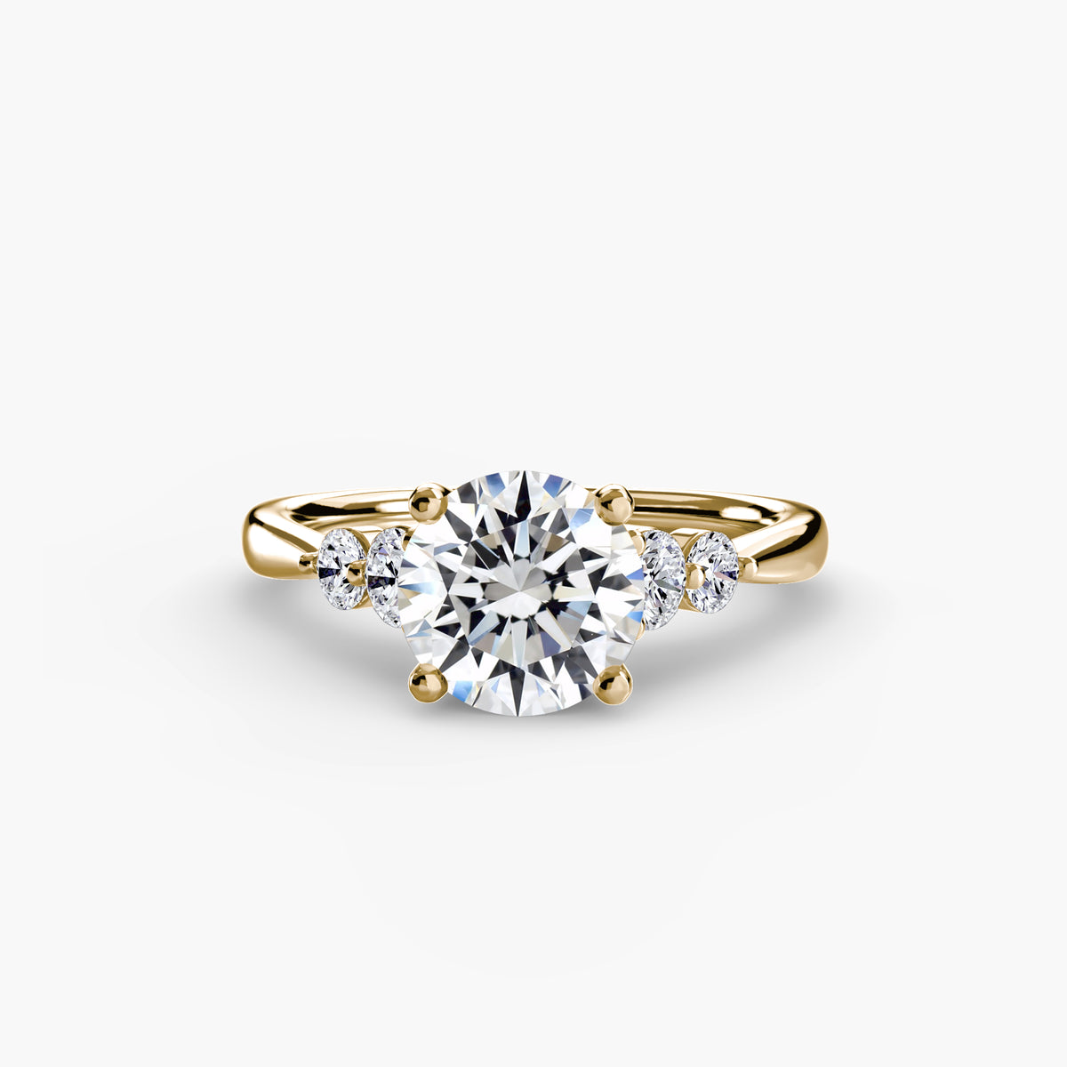 Solitaire with Shoulder Accents engagement ring in yellow gold