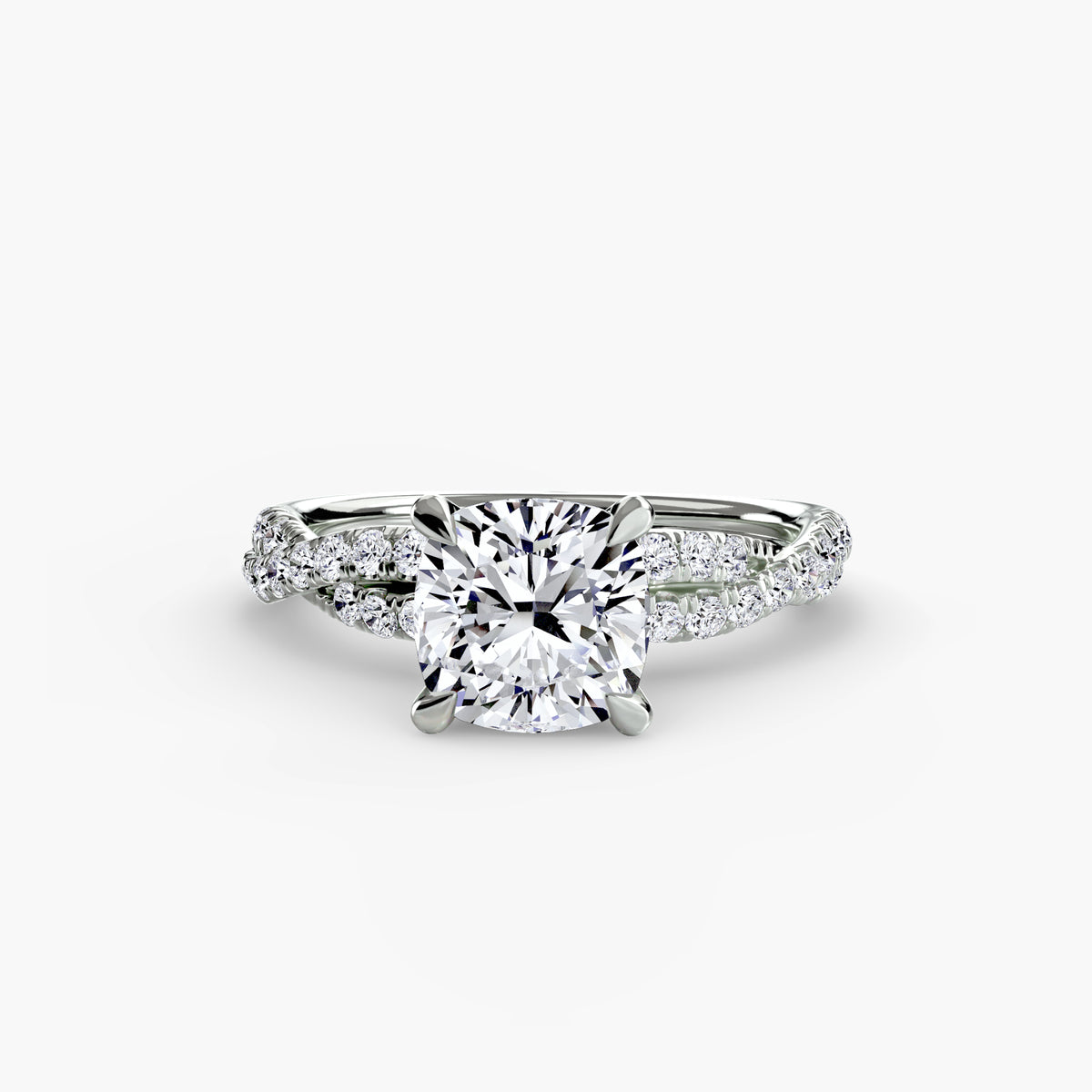 The Twisted Pavé Solitaire engagement ring in white gold with a cushion-cut centre stone