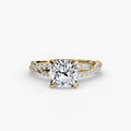 The Twisted Pavé Solitaire engagement ring in yellow gold with a cushion-cut centre stone