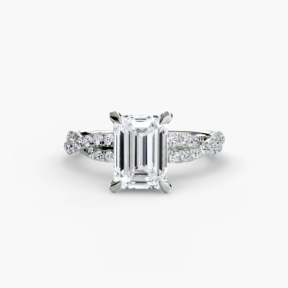 The Twisted Pavé Solitaire engagement ring in white gold with an emerald-cut centre stone
