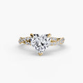 The Twisted Pavé Solitaire engagement ring in yellow gold with a heart-shaped centre stone