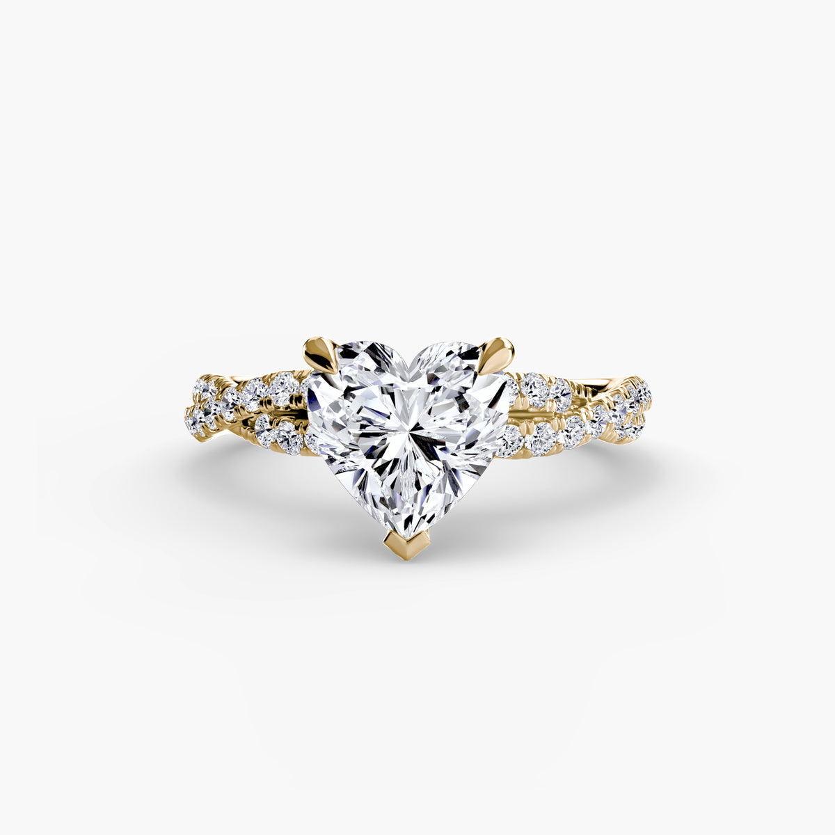 The Twisted Pavé Solitaire engagement ring in yellow gold with a heart-shaped centre stone