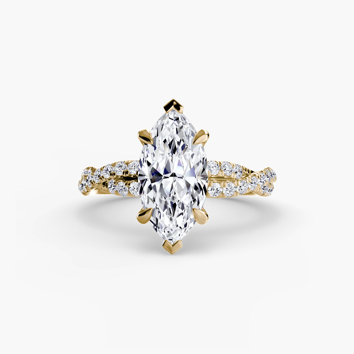 The Twisted Pavé Solitaire engagement ring in yellow gold with a marquise centre stone