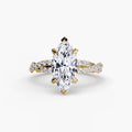 The Twisted Pavé Solitaire engagement ring in yellow gold with a marquise centre stone