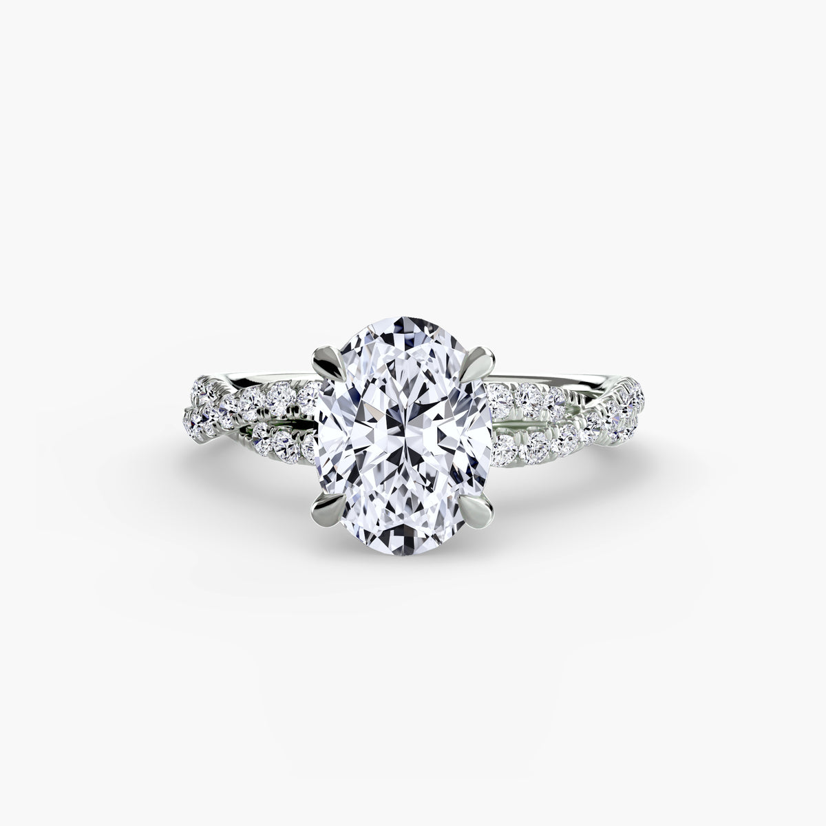 The Twisted Pavé Solitaire engagement ring in white gold with an oval centre stone