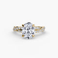 The Twisted Pavé Solitaire engagement ring in yellow gold with an oval centre stone