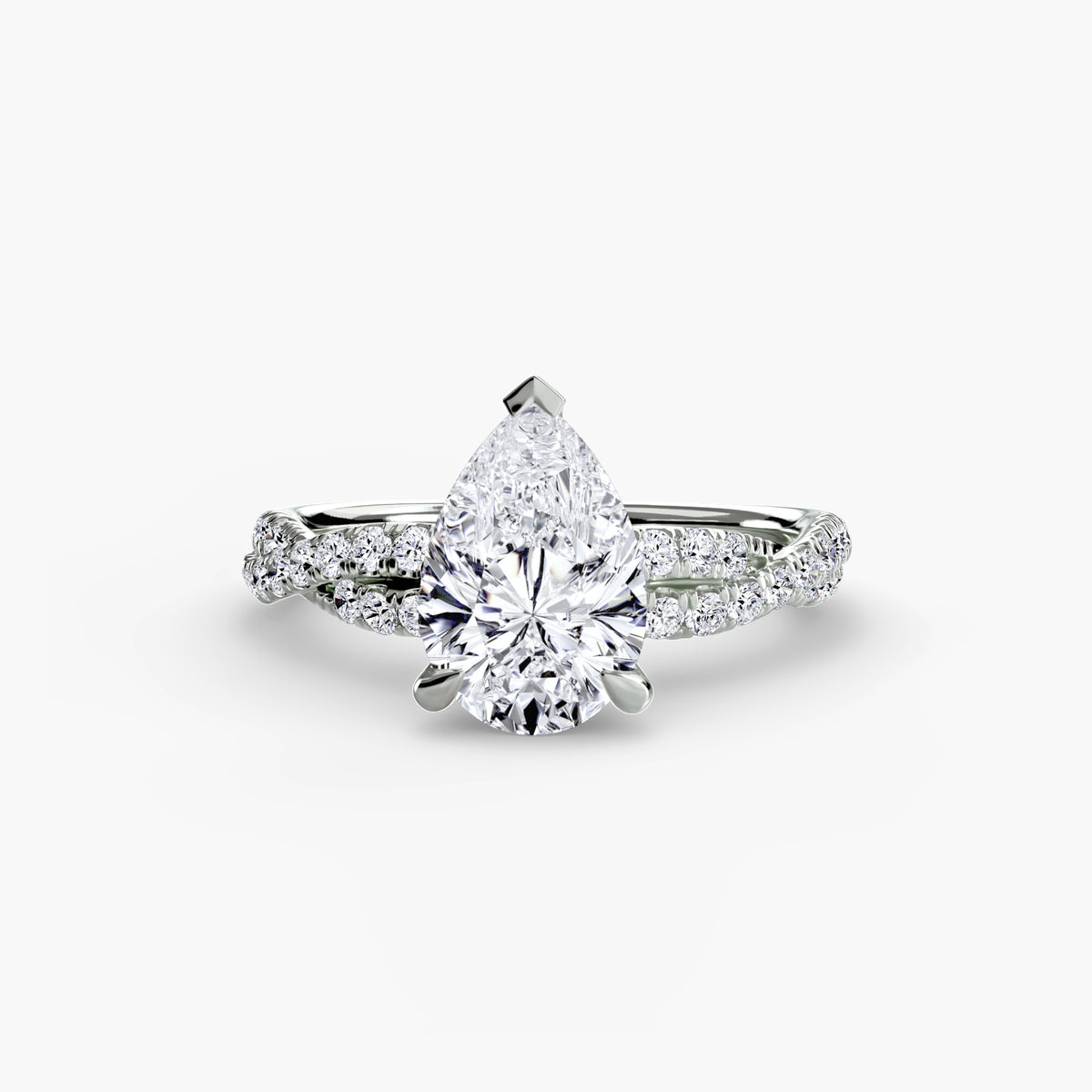 The Twisted Pavé Solitaire engagement ring in white gold with a pear-shaped centre stone