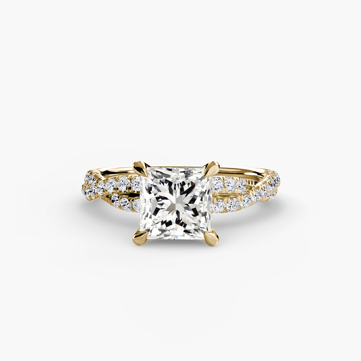 The Twisted Pavé Solitaire engagement ring in yellow gold with a princess-cut centre stone