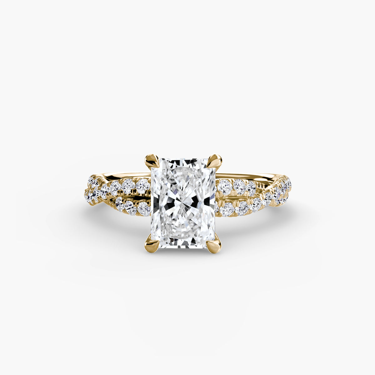 The Twisted Pavé Solitaire engagement ring in yellow gold with a radiant-cut centre stone