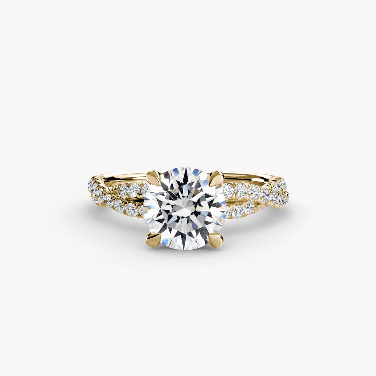 The Twisted Pavé Solitaire engagement ring in yellow gold with a round centre stone