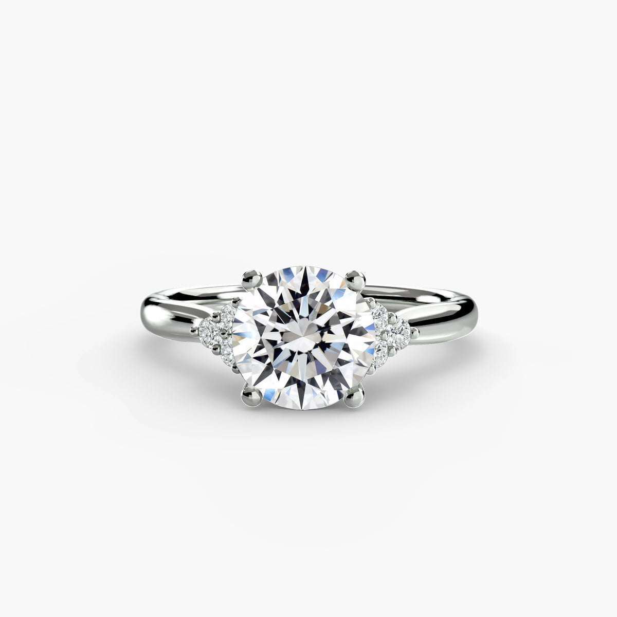 Solitaire with Cluster Shoulders engagement ring in white gold with a round centre stone