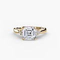 Solitaire with Cluster Shoulders engagement ring in yellow gold with an Asscher-cut centre stone