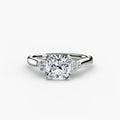 Solitaire with Cluster Shoulders engagement ring in white gold with a cushion-cut centre stone