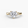 Solitaire with Cluster Shoulders engagement ring in yellow gold with a heart-shaped centre stone
