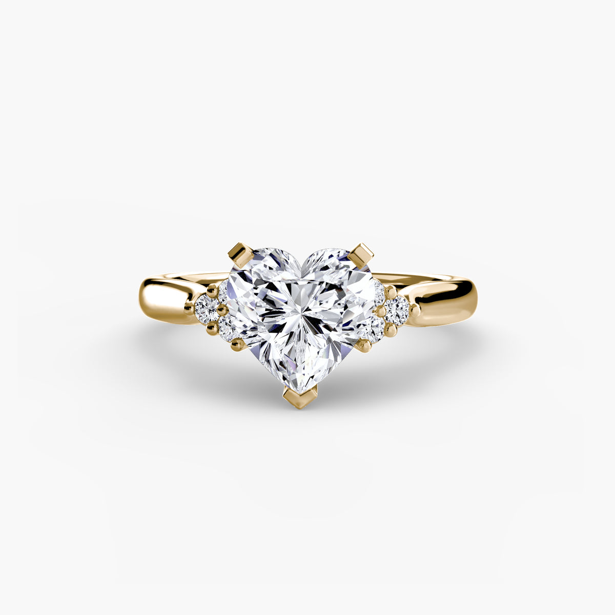 Solitaire with Cluster Shoulders engagement ring in yellow gold with a heart-shaped centre stone