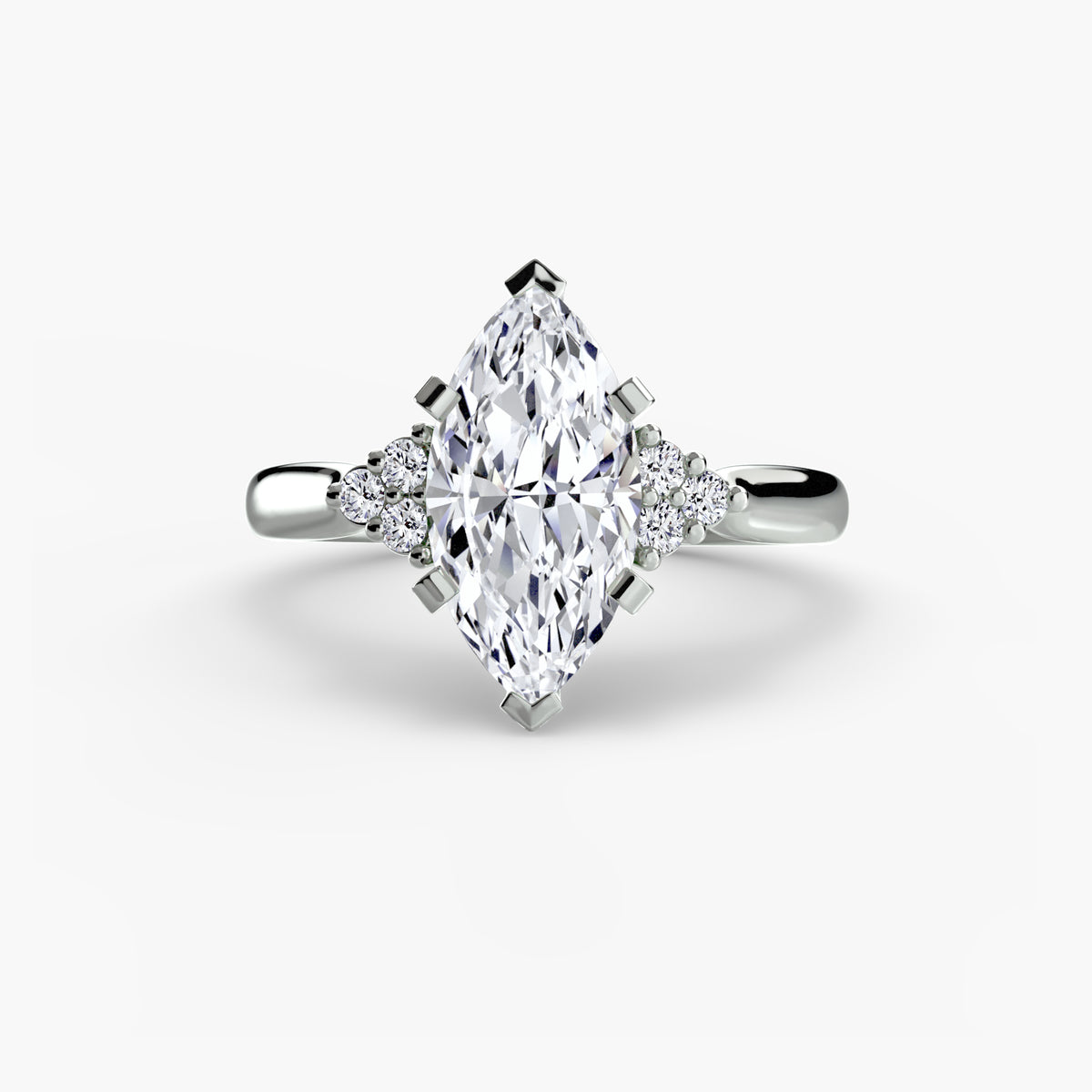 Solitaire with Cluster Shoulders engagement ring in white gold with a marquise centre stone