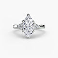 Solitaire with Cluster Shoulders engagement ring in white gold with a marquise centre stone