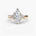 Solitaire with Cluster Shoulders engagement ring in yellow gold with a marquise centre stone