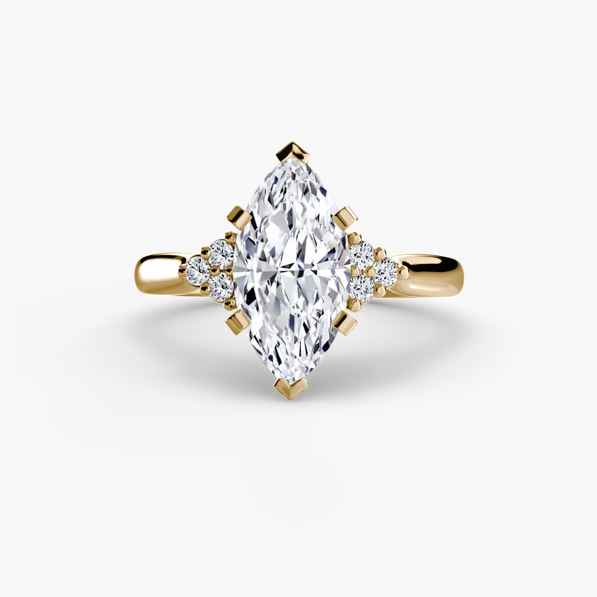 Solitaire with Cluster Shoulders engagement ring in yellow gold with a marquise centre stone