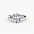 Solitaire with Cluster Shoulders engagement ring in white gold with an oval centre stone