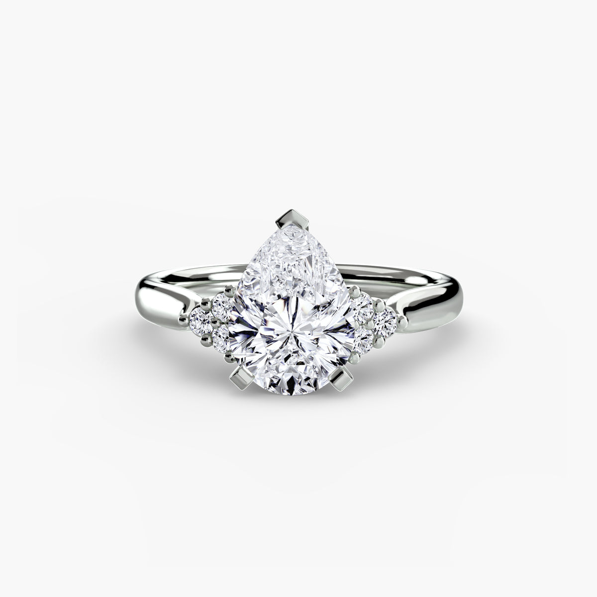Solitaire with Cluster Shoulders engagement ring in white gold with a pear-shaped centre stone