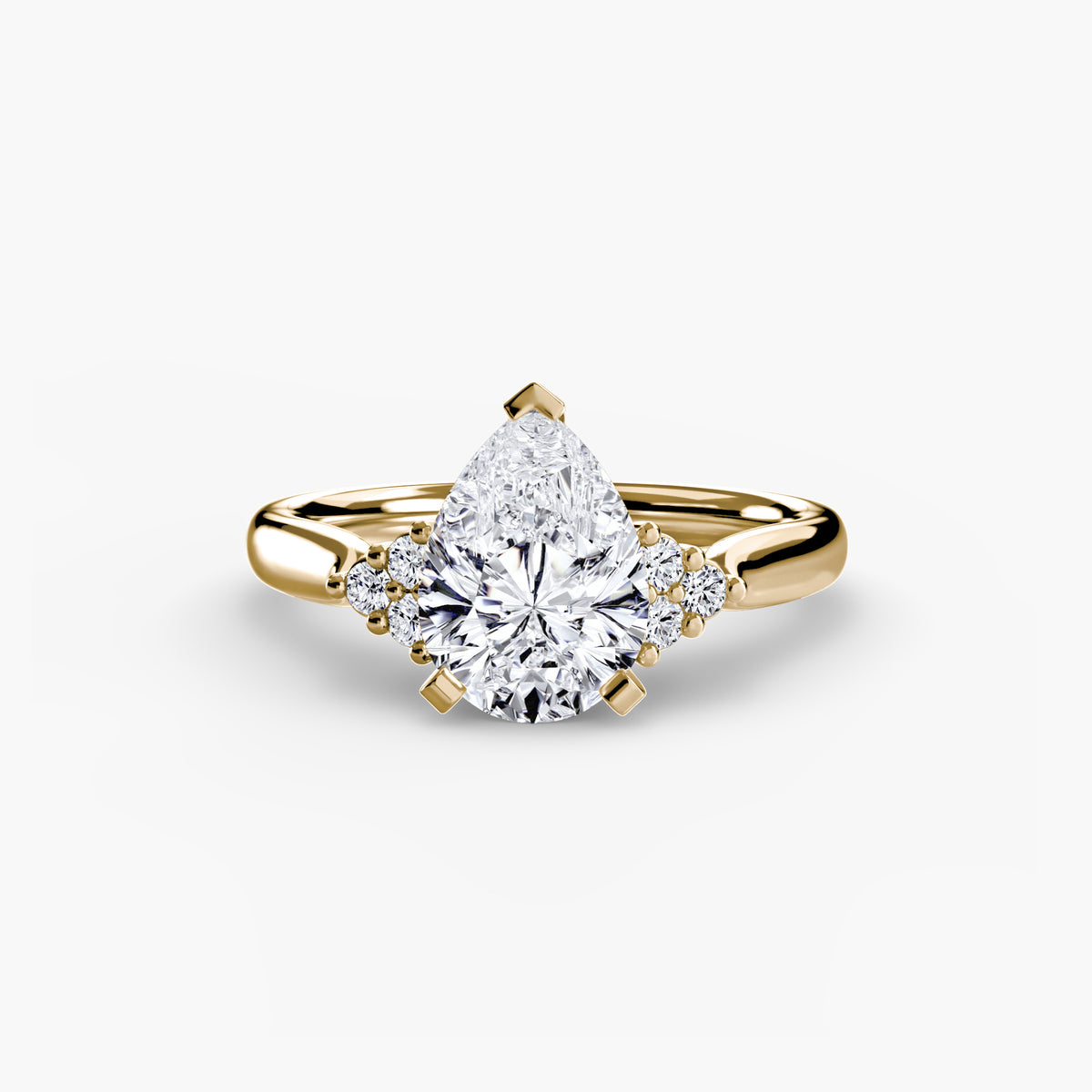 Solitaire with Cluster Shoulders engagement ring in yellow gold with a pear-shaped centre stone