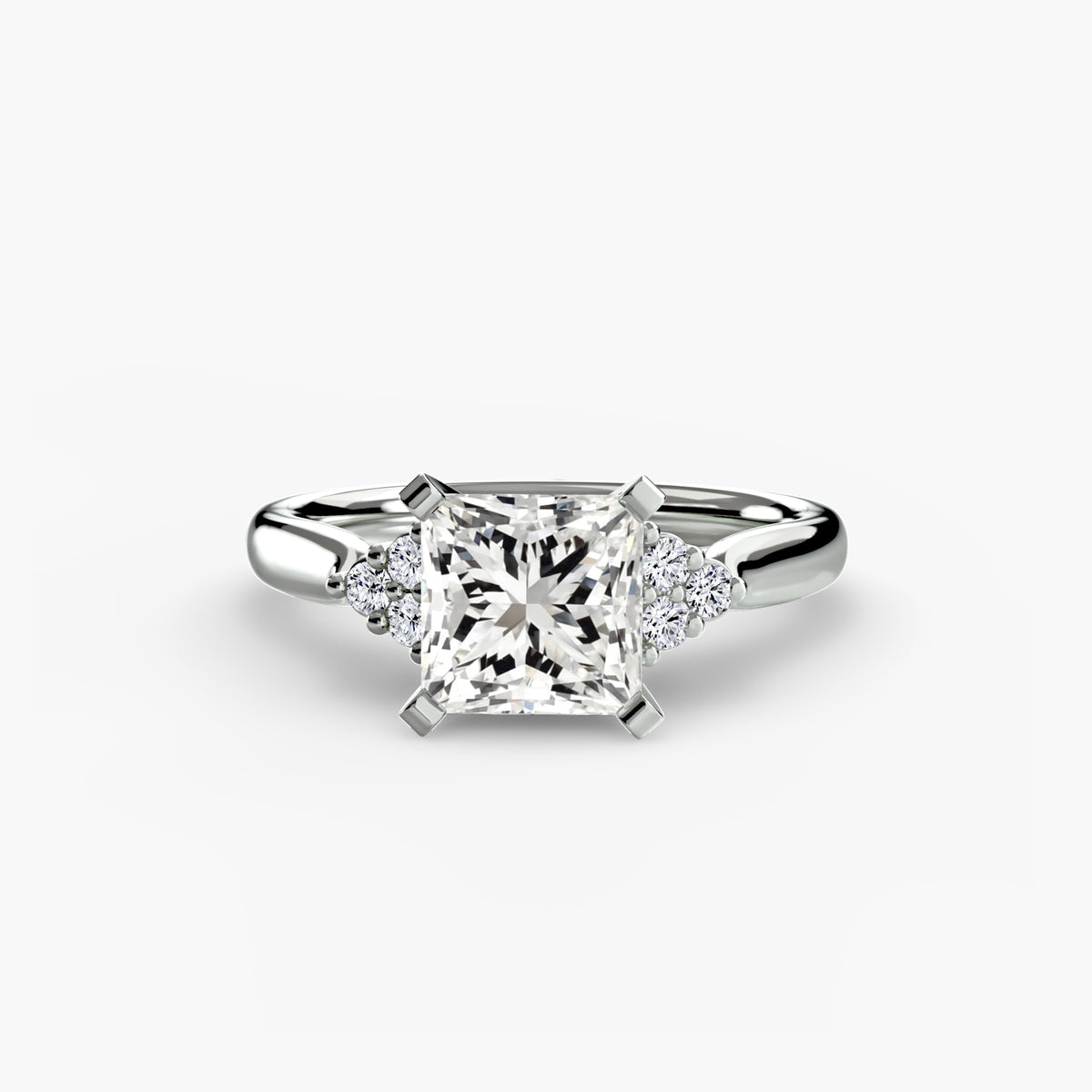 Solitaire with Cluster Shoulders engagement ring in white gold with a princess-cut centre stone