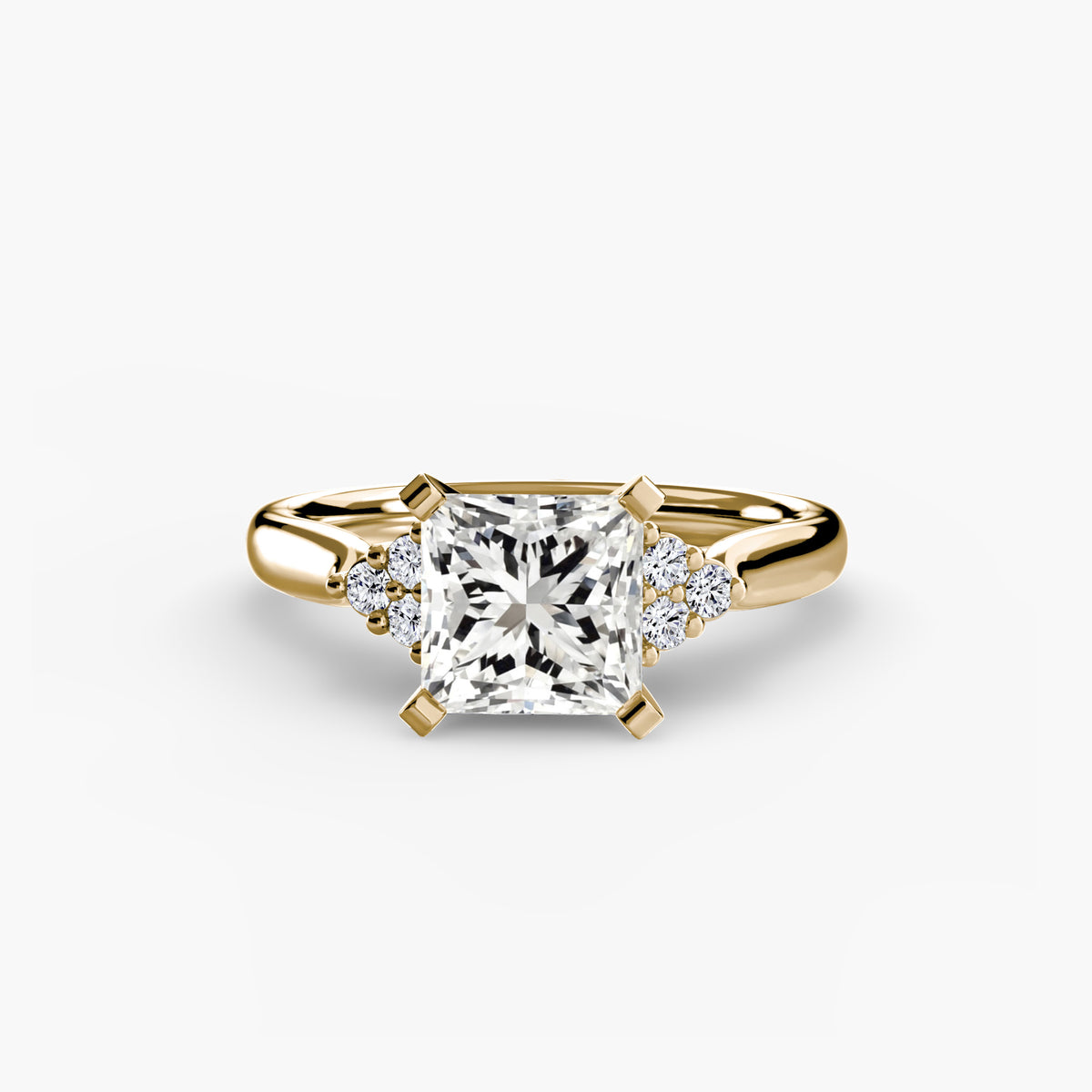 Solitaire with Cluster Shoulders engagement ring in yellow gold with a princess-cut centre stone