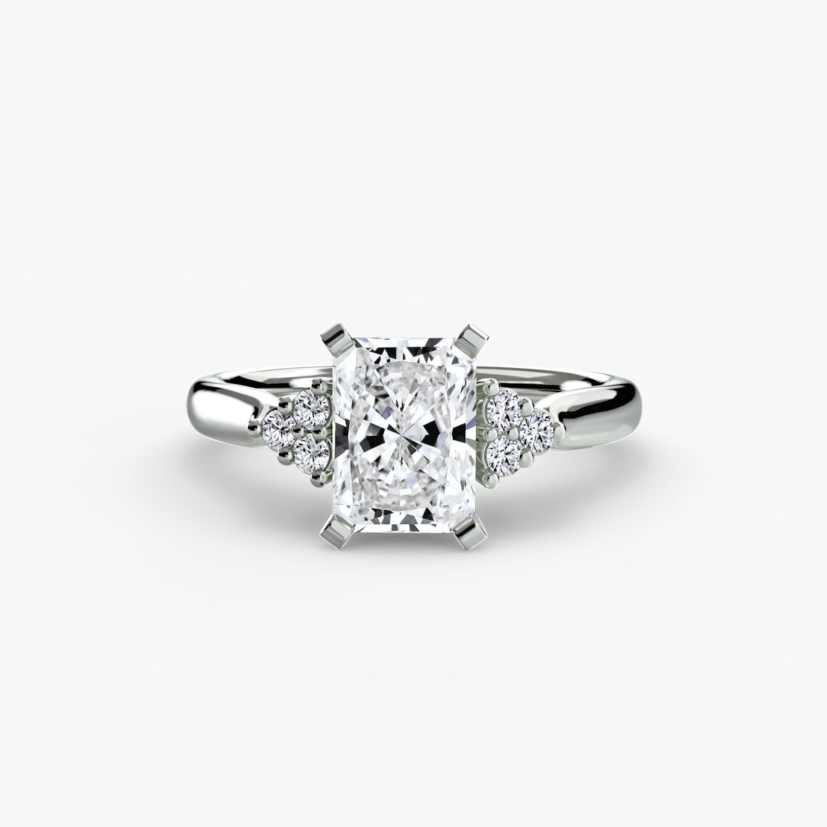 Solitaire with Cluster Shoulders engagement ring in white gold with a radiant-cut centre stone