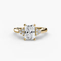 Solitaire with Cluster Shoulders engagement ring in yellow gold with a radiant-cut centre stone