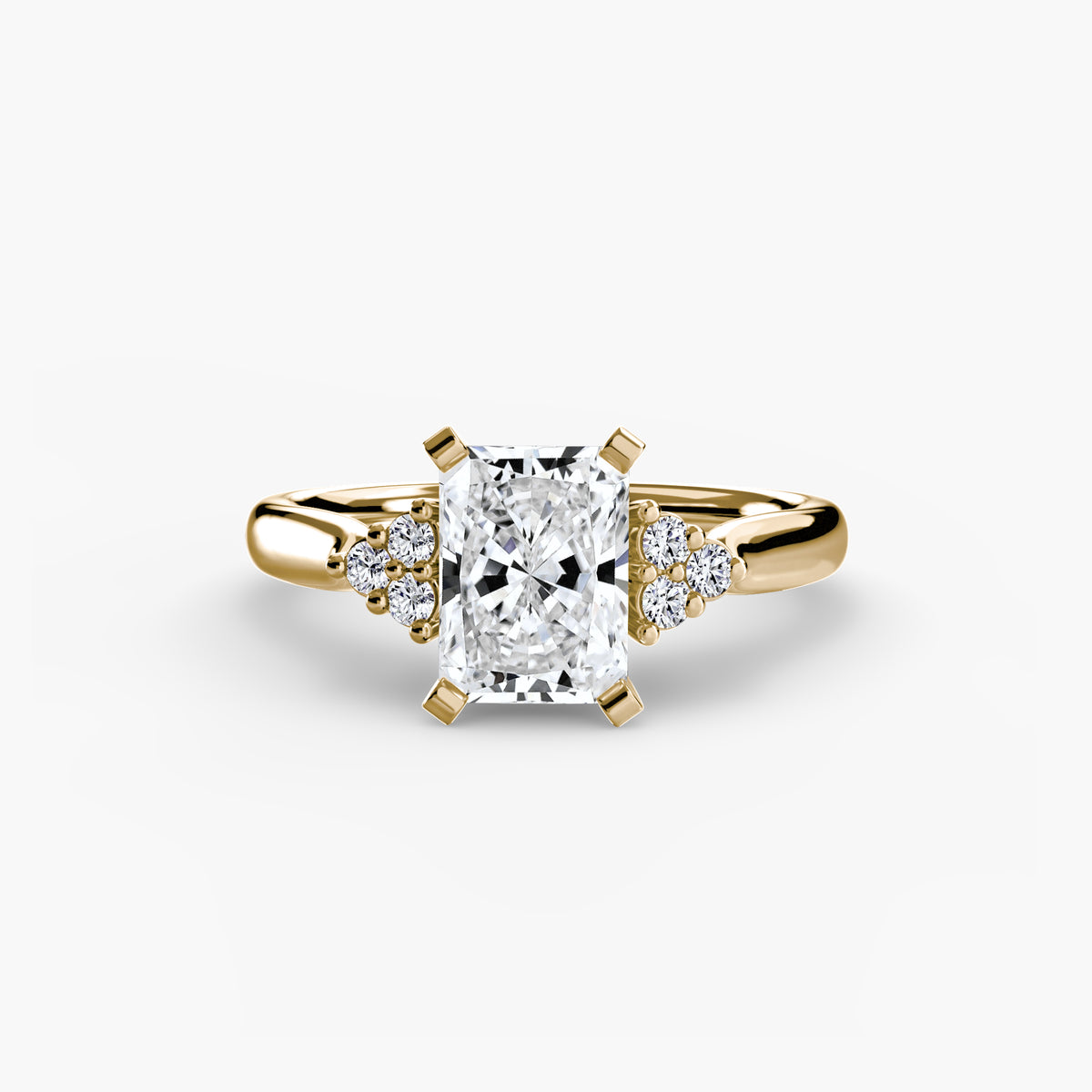 Solitaire with Cluster Shoulders engagement ring in yellow gold with a radiant-cut centre stone