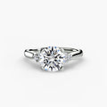 Solitaire with Cluster Shoulders engagement ring in white gold with a round centre stone