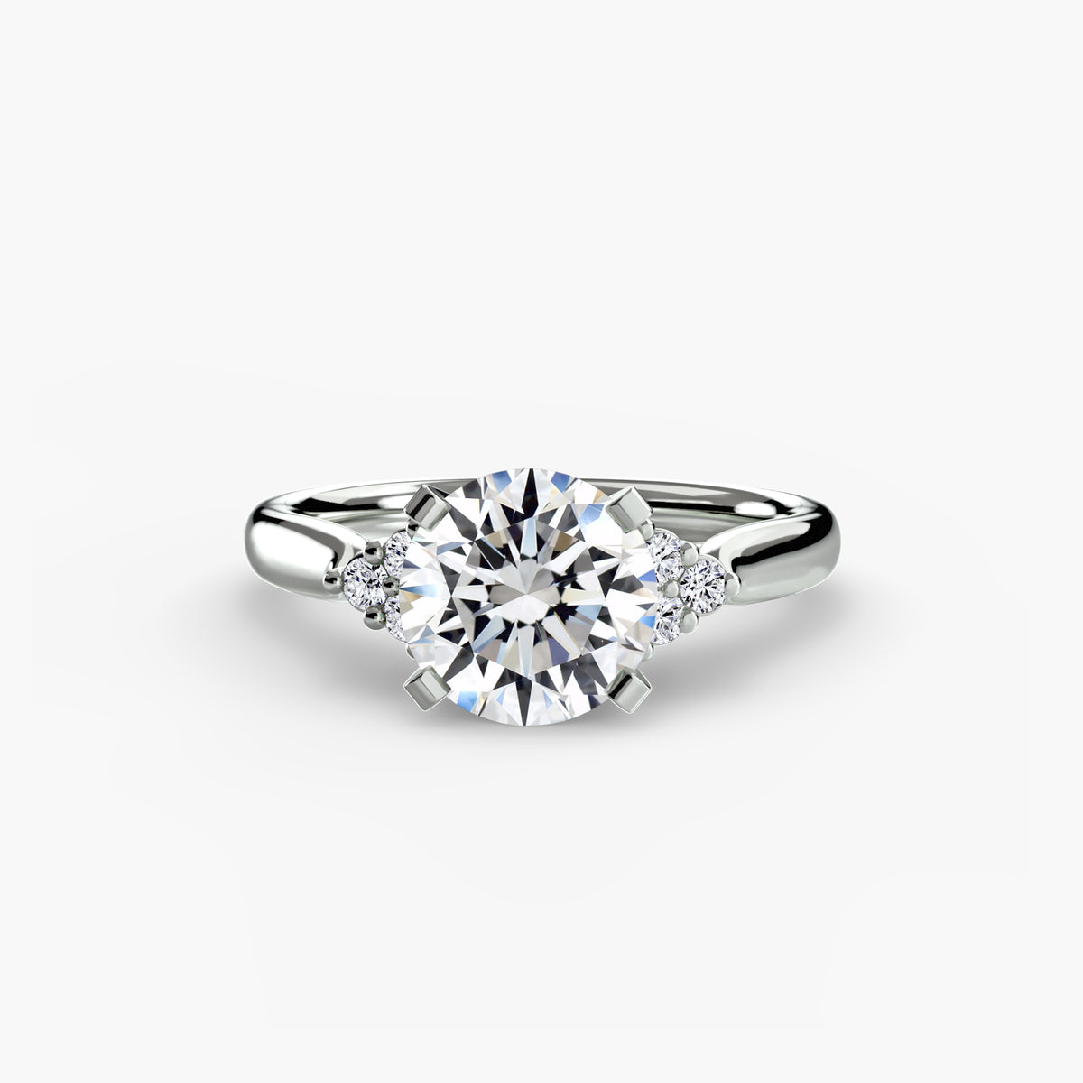 Solitaire with Cluster Shoulders engagement ring in white gold with a round centre stone
