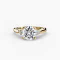 Solitaire with Cluster Shoulders engagement ring in yellow gold with a round centre stone