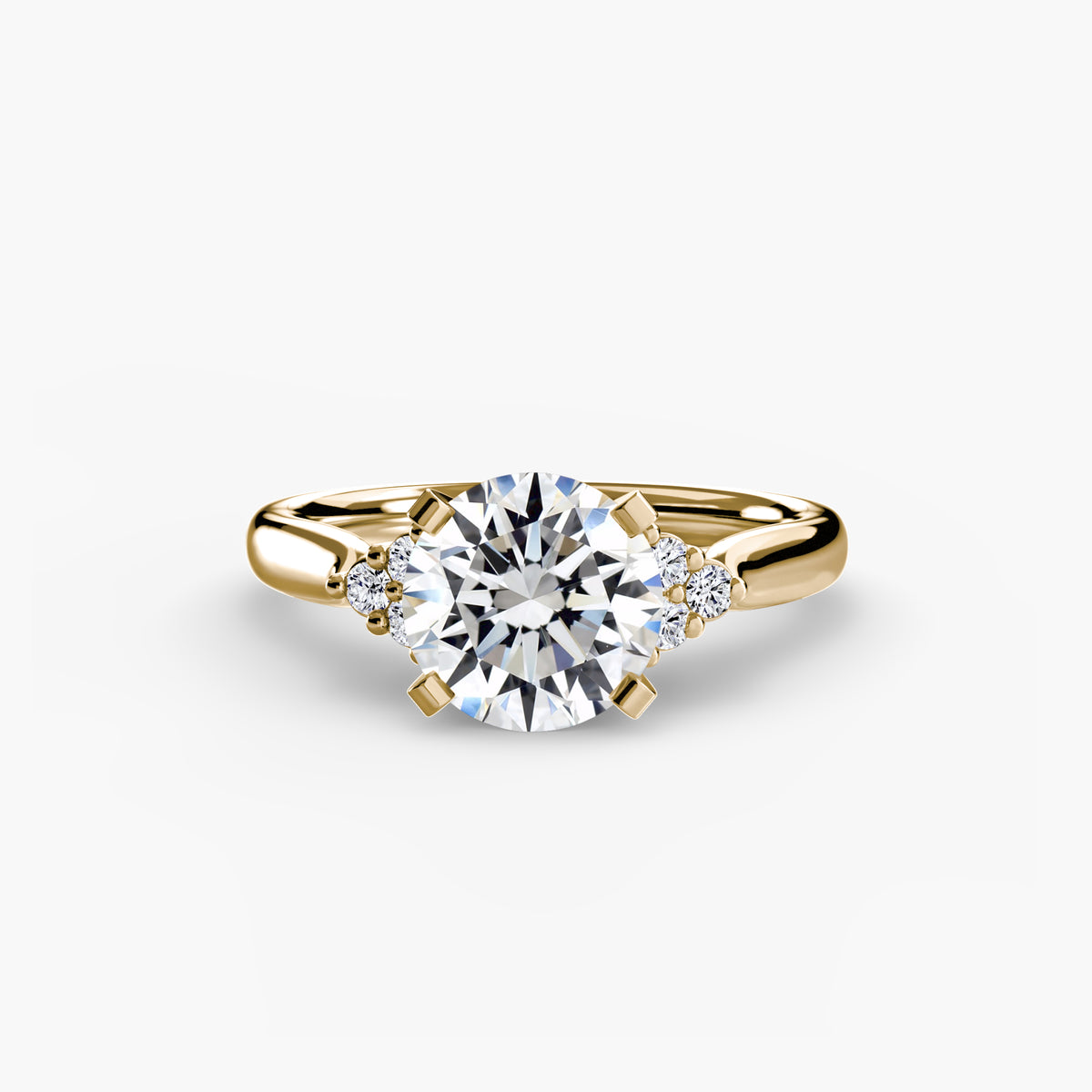 Solitaire with Cluster Shoulders engagement ring in yellow gold with a round centre stone