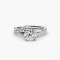The Emerald Twist Pavé Ring in white gold with a cushion-cut centre stone