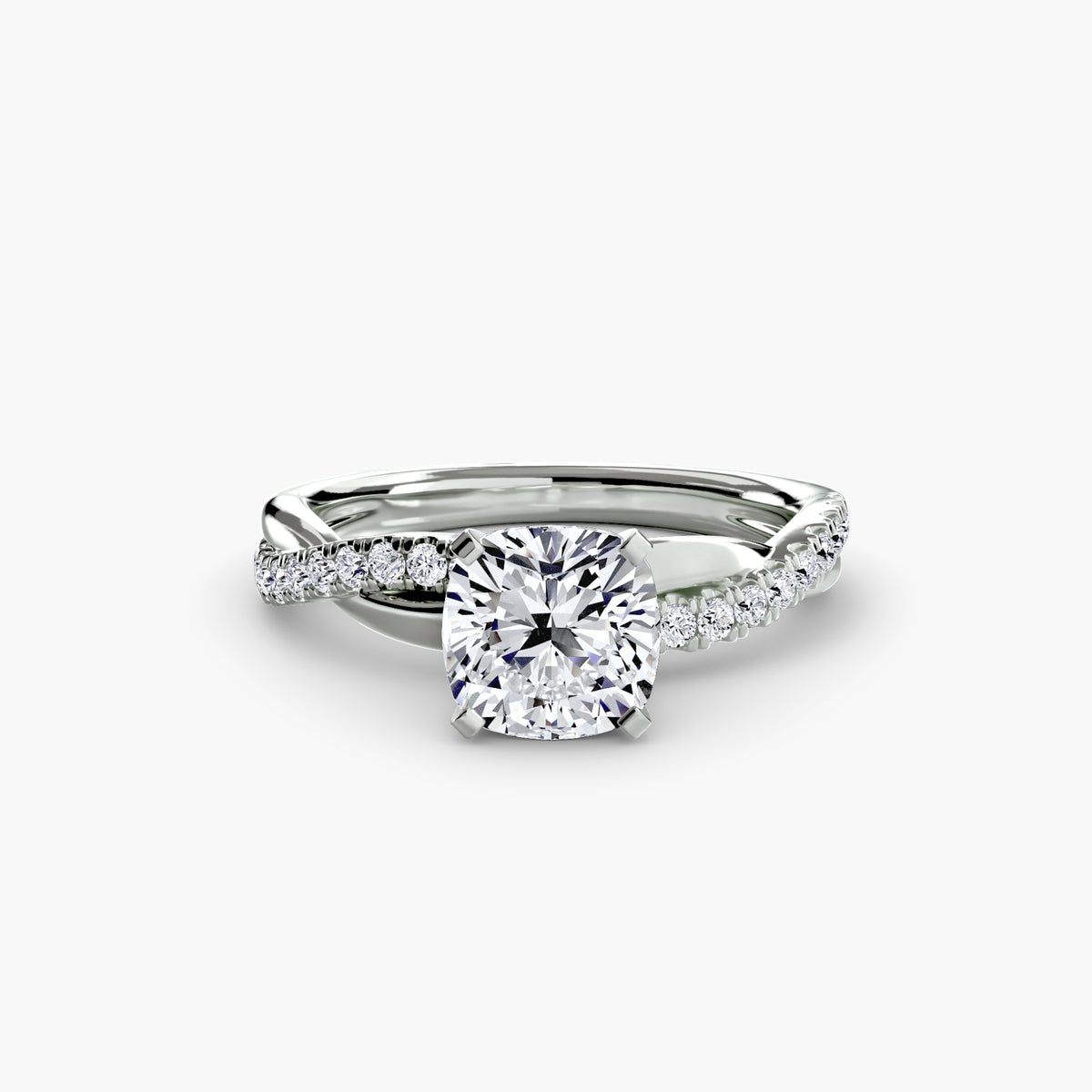 The Emerald Twist Pavé Ring in white gold with a cushion-cut centre stone