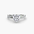 The Emerald Twist Pavé Ring in white gold with a heart-shaped centre stone
