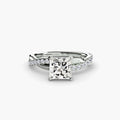 The Emerald Twist Pavé Ring in white gold with a princess-cut centre stone