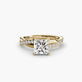 The Emerald Twist Pavé Ring in yellow gold with a princess-cut centre stone