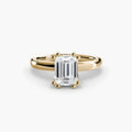 Solitaire ring in yellow gold with an emerald-cut centre stone