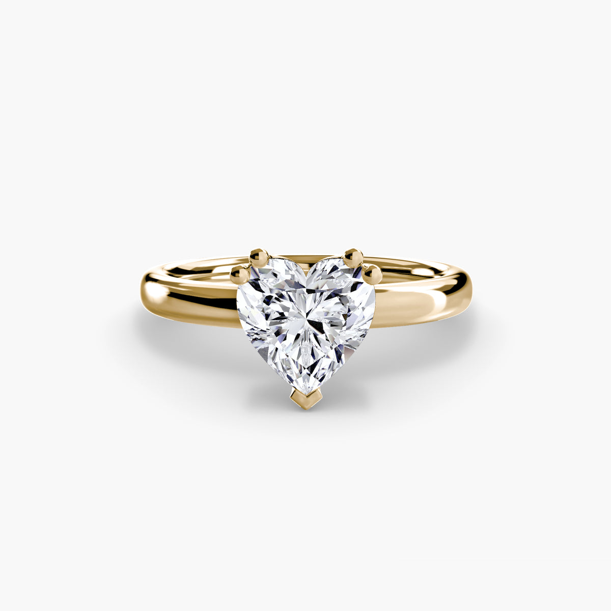Solitaire ring in yellow gold with a heart-shaped centre stone