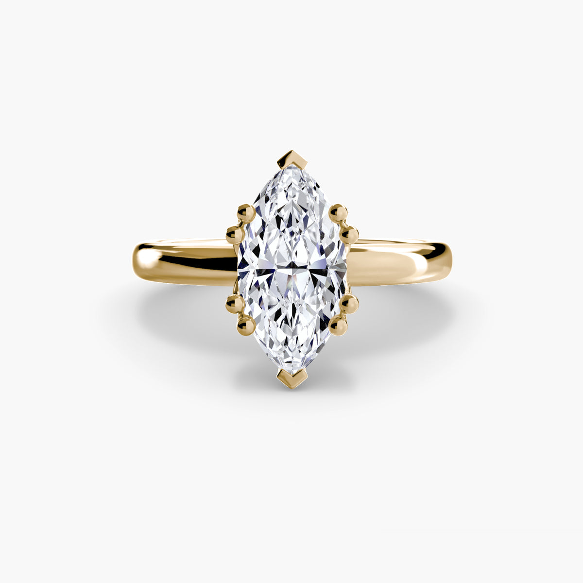 Solitaire ring in yellow gold with a marquise centre stone