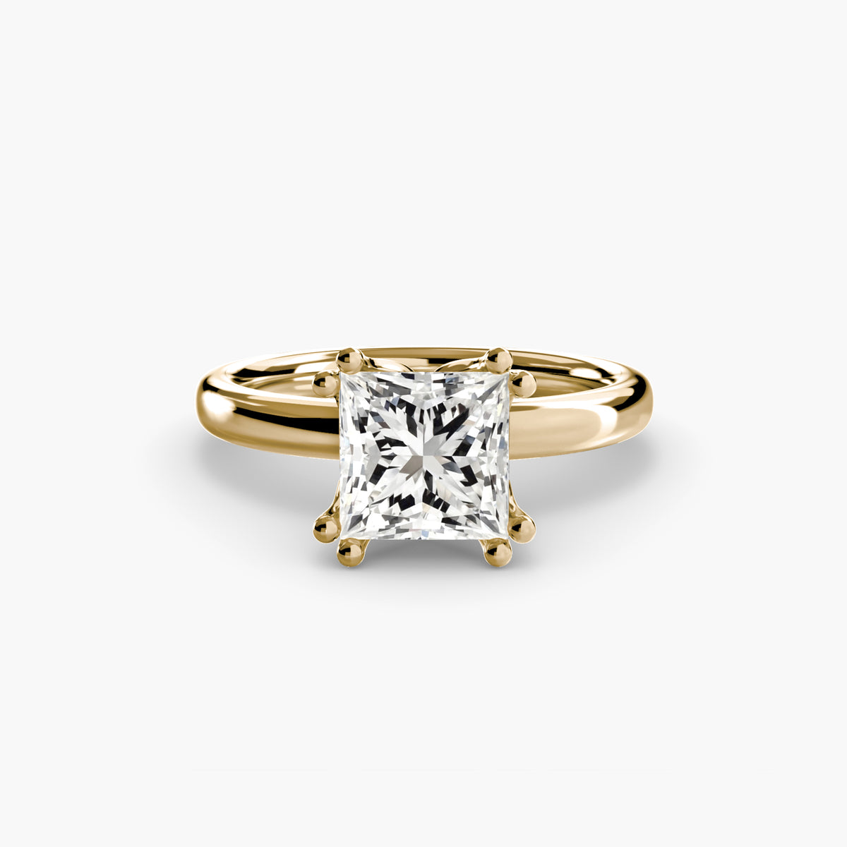 Solitaire ring in yellow gold with a princess-cut centre stone