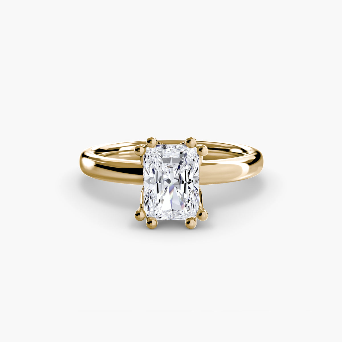 Solitaire ring in yellow gold with a radiant-cut centre stone