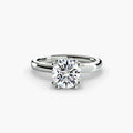 Solitaire ring in white gold with a round centre stone