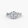The Twist Pavé Ring in white gold with a round centre stone
