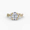 The Twist Pavé Ring in yellow gold with a round centre stone