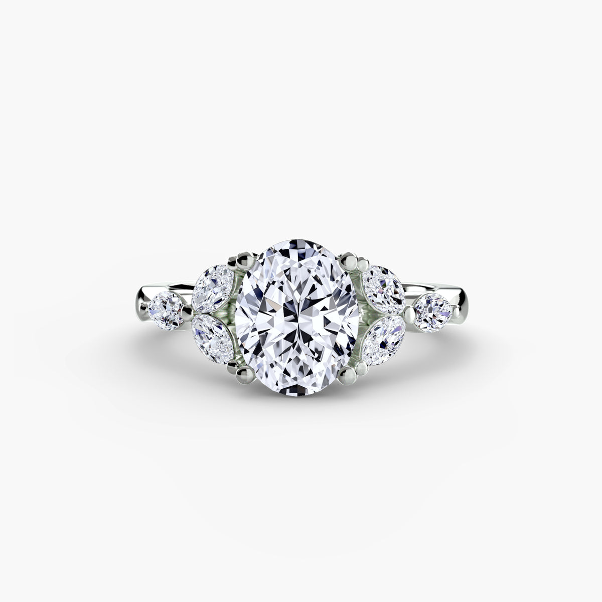 The Shoulder Cluster Ring in white gold with an oval centre stone