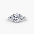 The Shoulder Cluster Ring in white gold with an oval centre stone